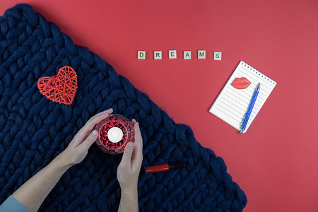 on red and blue background women's accessories, cosmetics and decorative items, Notepad and penの写真素材