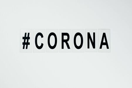 black hashtag corona  in the middle on white background big black lettersの写真素材