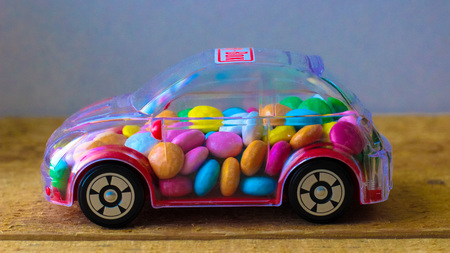 candy in toy car - money boxの写真素材