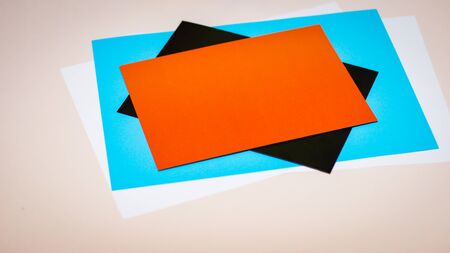 Several sheets of paper in different colors stacked on top of each otherの写真素材