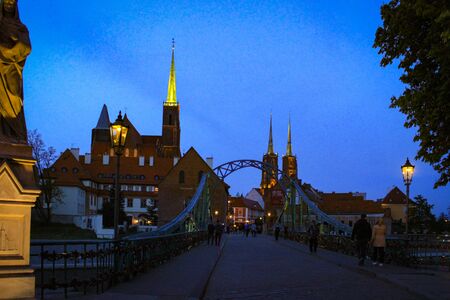 Night Photo With A View Of Tumski Bridge And The Catholic Cathedral Of St. John The Baptist In WrocÅaw, Poland.の写真素材