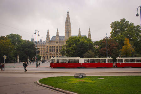 Vienna, Austria - October 09, 2015 : View Of The Vienna City Hall. People Are Walking Along The Crosswalk. Tram On The Way.のeditorial素材