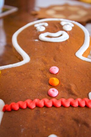 Close-Up Of Cookies On Wooden Background. Holiday Decoration Classic Gingerbread Man Cookie.の写真素材