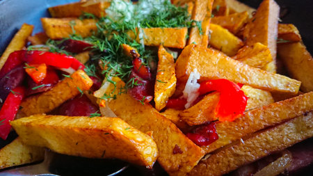 Slices Of Deep-fried Potatoes And Grilled Bell Peppers, Seasoned With Garlic And Dill
