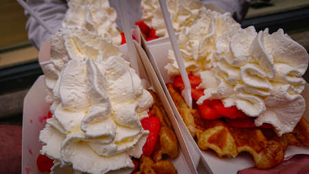 Popular Street Food In Belgium. Famous Belgian Waffles With Strawberries And Whipped Cream.の写真素材