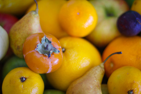 Fruit background. Apples, oranges, pears, persimmons, plums.の写真素材
