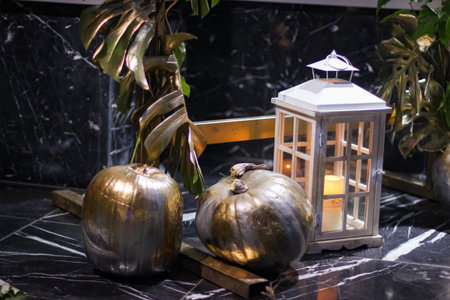 Halloween's holiday attributes in evening. Lantern and pumpkinsの写真素材