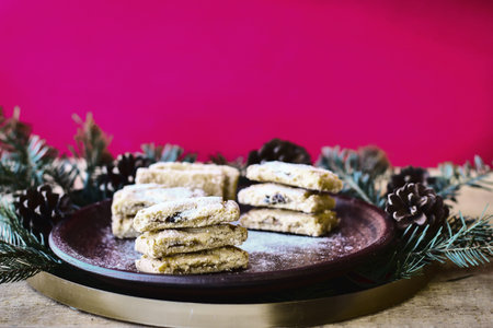 Wonderful biscuits on clay plate. Against background of red wall
