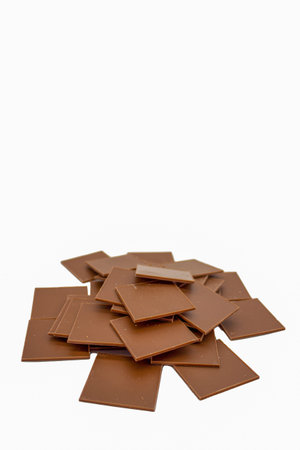 Few bars of milk chocolate on white background