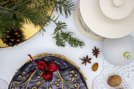 Delicious chocolate cake with Santa, with nuts and Christmas decorの写真素材
