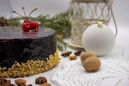 Delicious chocolate cake with Santa, with nuts and Christmas decorの写真素材