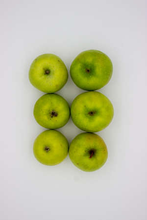 Few green apples on white background. isolated imageの写真素材