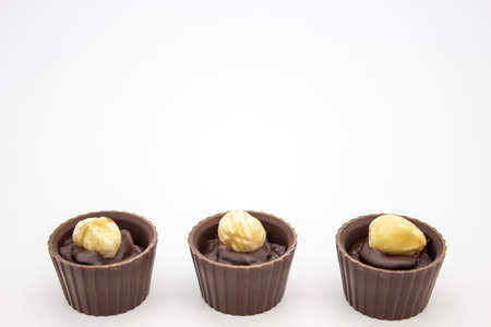 Few chocolates candy with filling on white backgroundの写真素材