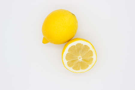 Few ripe lemons on light background. isolated imageの写真素材