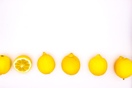 Few ripe lemons on light background. isolated image