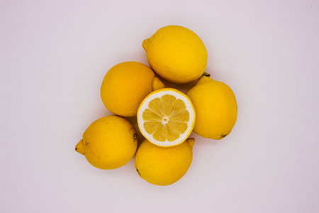 Few ripe lemons on light background. isolated imageの写真素材
