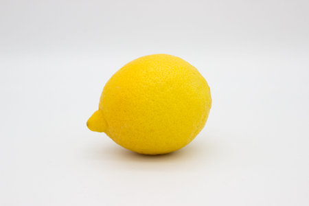 Ripe lemon on light background. isolated image