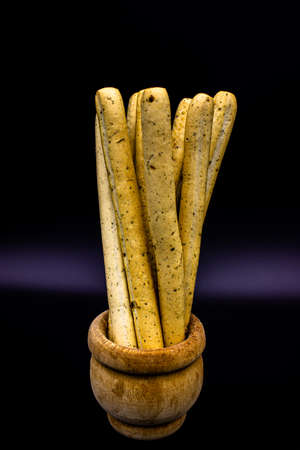 Italian breadsticks grissini on dark backgroundの写真素材