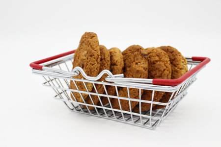 oatmeal cookies in basket from store on white backgroundの写真素材