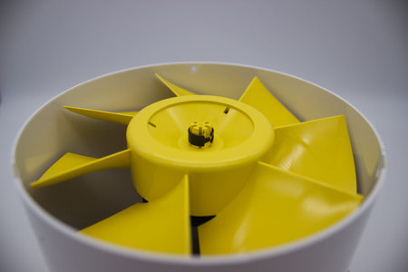 Smooth yellow plastic fan blades in a close-up view, showing design and functionality. Ideal for...