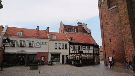 Gdansk, Poland. June 07, 2019. Historic square surrounded by traditional townhouses near a brick...