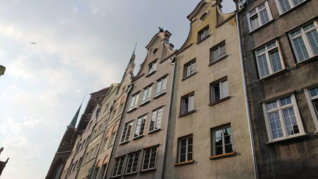 GDANSK, POLAND - JUNE 07, 2019: Low angle perspective of decorative gables of traditional tenement...