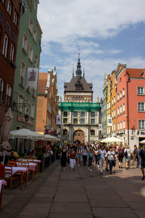 Gdansk, Poland. June 07, 2019. Tourists and locals walking along Dluga Street with colorful historic...