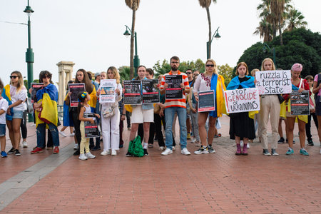 Malaga, Andalusia, Spain -  October 22, 2022. Protestants with banners on the square.のeditorial素材