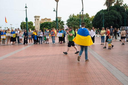 Malaga, Andalusia, Spain -  October 22, 2022. Protestants with banners on the square.