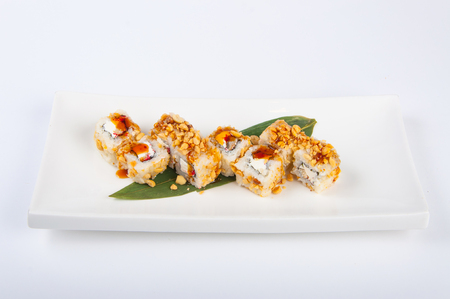 sushi roll with tuna, Philadelphia cheese, flying fish caviar, peanutsの写真素材