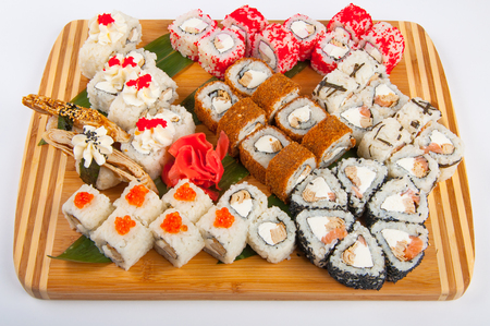 sushi rolls assorted on a wooden Board concept: deliveryの写真素材