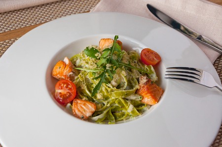 Spinach fettuccine with salmon - Italian food styleの写真素材