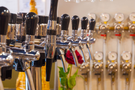 Beer taps in a pubの写真素材
