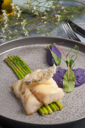 tasty white fish with green asparagus. Concept: healthy food