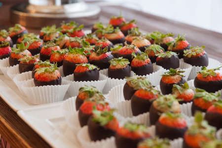 tasty chocolate-covered strawberries at the reception. close up. selected focusの写真素材