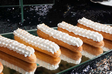 tasty Eclair with singed protein cream on the mirrorの写真素材