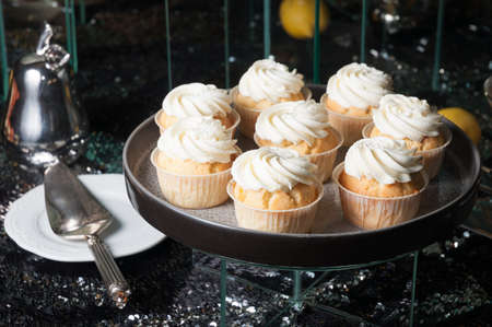 sweet cupcakes with protein cream on a dark backgroundの写真素材