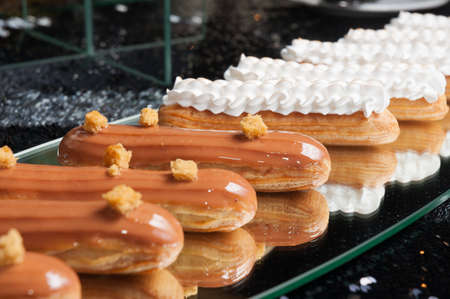 tasty Eclair with singed protein cream on the mirrorの写真素材