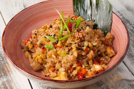 tasty fried rice with chicken and vegetables. Asian dishの写真素材
