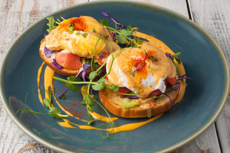 tasty wheat bun with salmon and poached egg. Concept: Breakfast