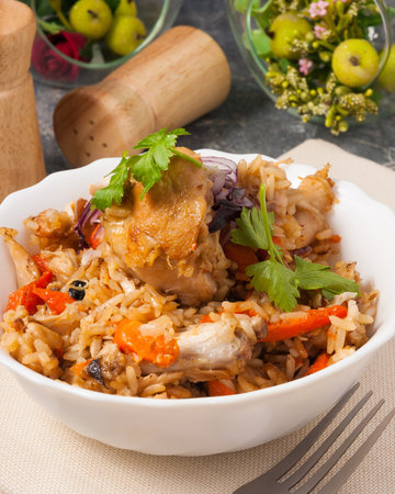 tasty pilaf with chicken decorated with parsley. close upの写真素材