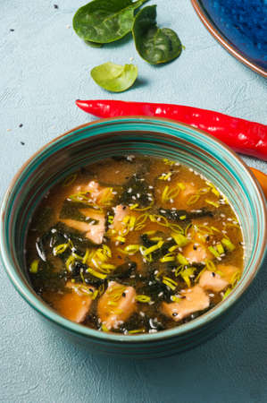 tasty Asian soup with salmon and nori seaweedの写真素材