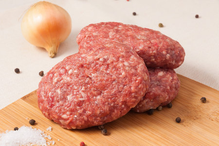 beef cutlets with onions on a wooden Board