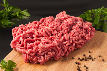 tasty raw minced lamb on a wooden Boardの写真素材