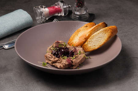 tasty liver pate with drunk cherries and crispy baguetteの写真素材
