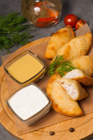 posikunchiki - small pies with meat, with mustard dressing and sour cream