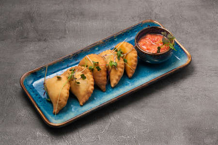 POSIKUNCHIKI - small tasty pies with meat filling, with tomato sauceの写真素材
