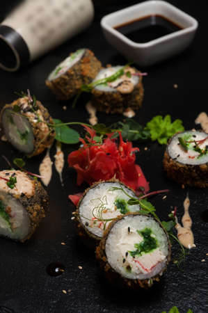 tasty tempura sushi rolls with crab meat, cream cheese, seaweedの写真素材