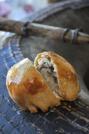 traditional Uzbek dish - tasty samsa with chicken or beef on tandoorの写真素材