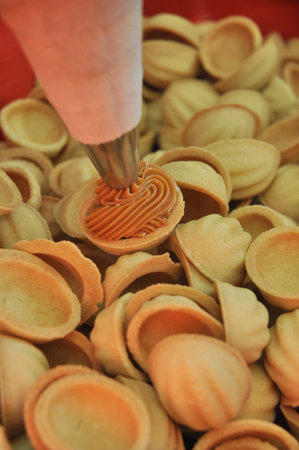 sweet nuts with condensed milk. concept: confectionery production